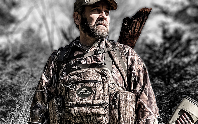 hunter wearing camo chest vest
